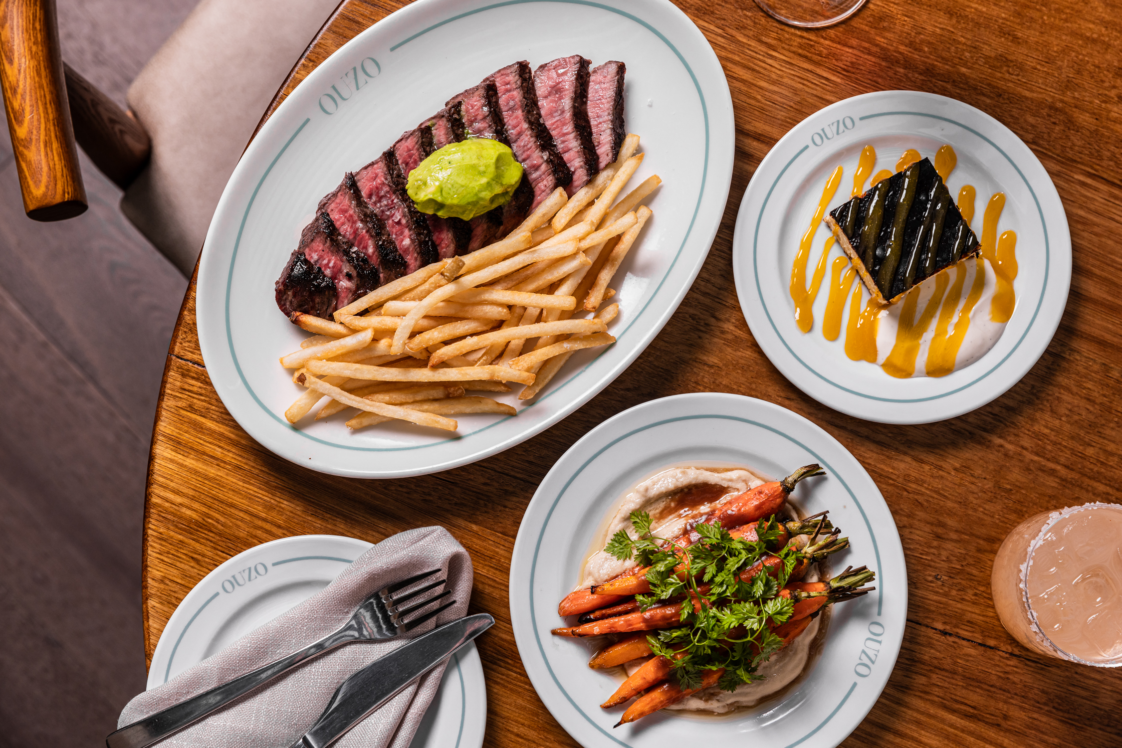 Butcher’s cut steak with fries, charred carrots and dessert