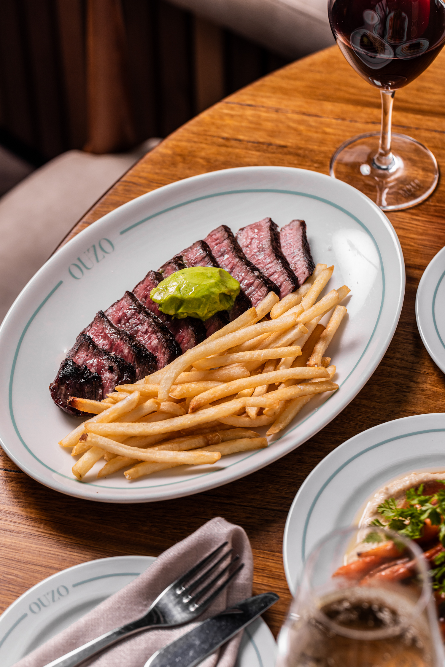 Steak frites with herb butter and red wine