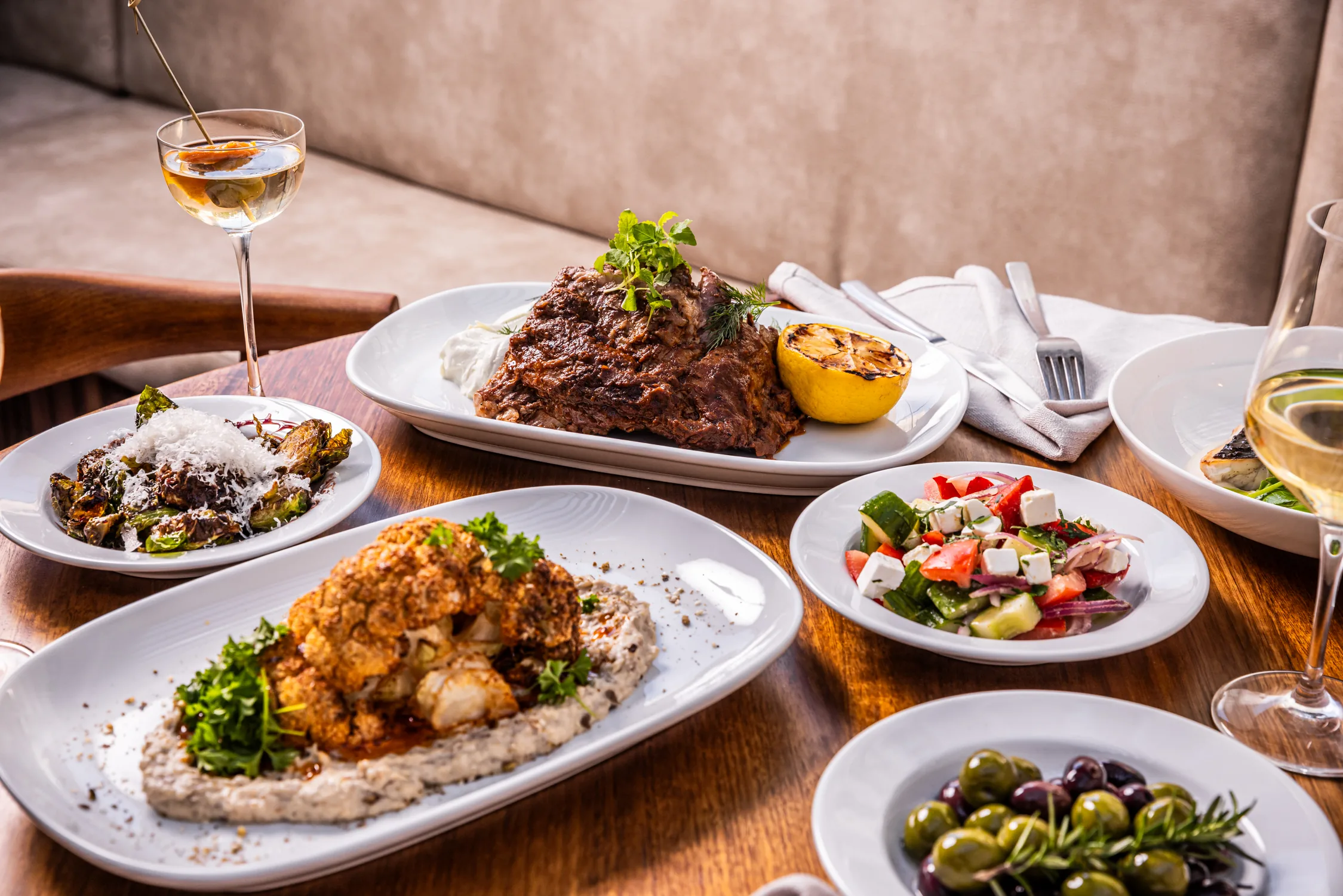 Mediterranean feast — cauliflower, Greek salad, braised meat